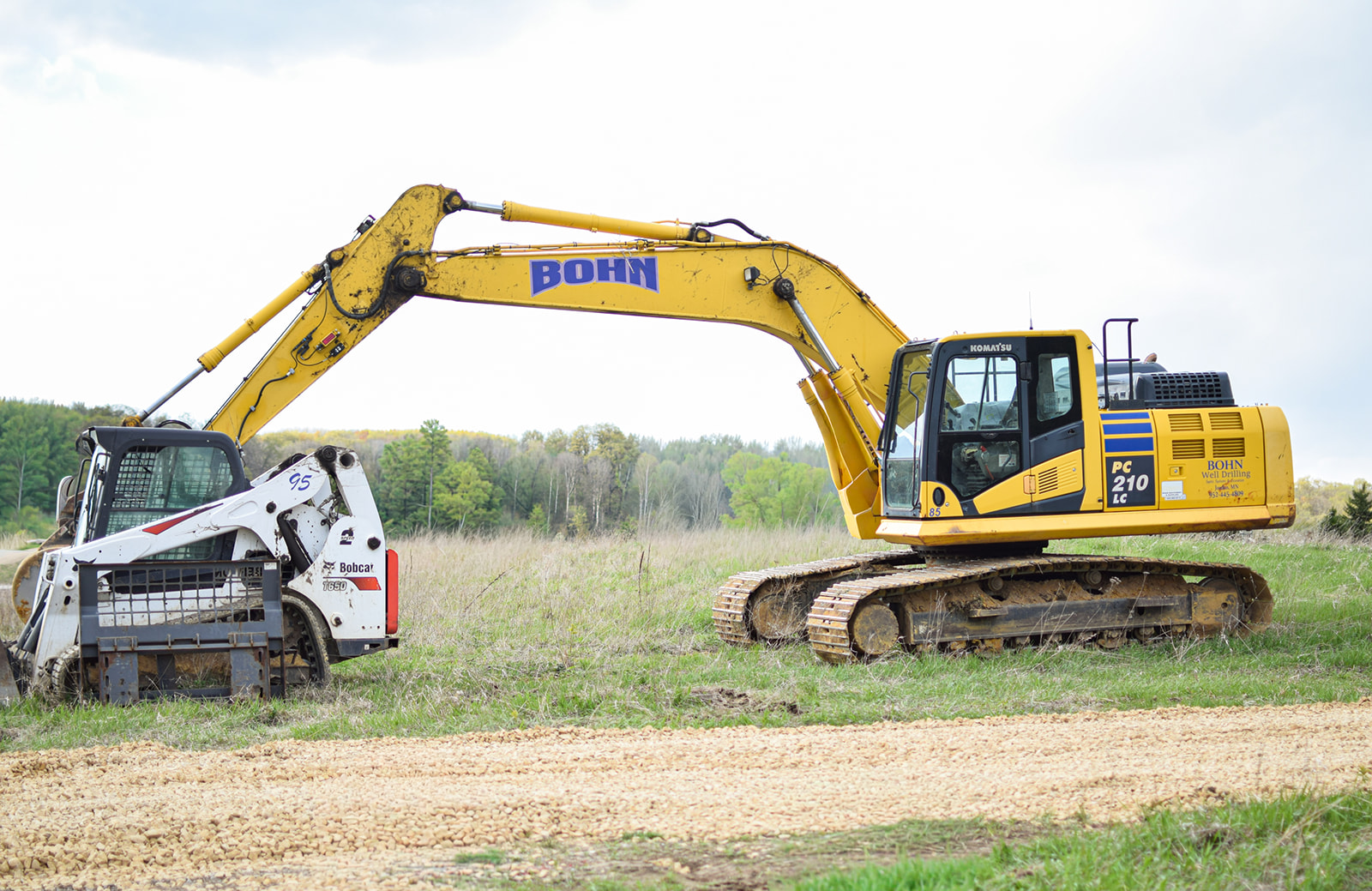 An excavator and skid steer staged on the lot Tuesday morning.